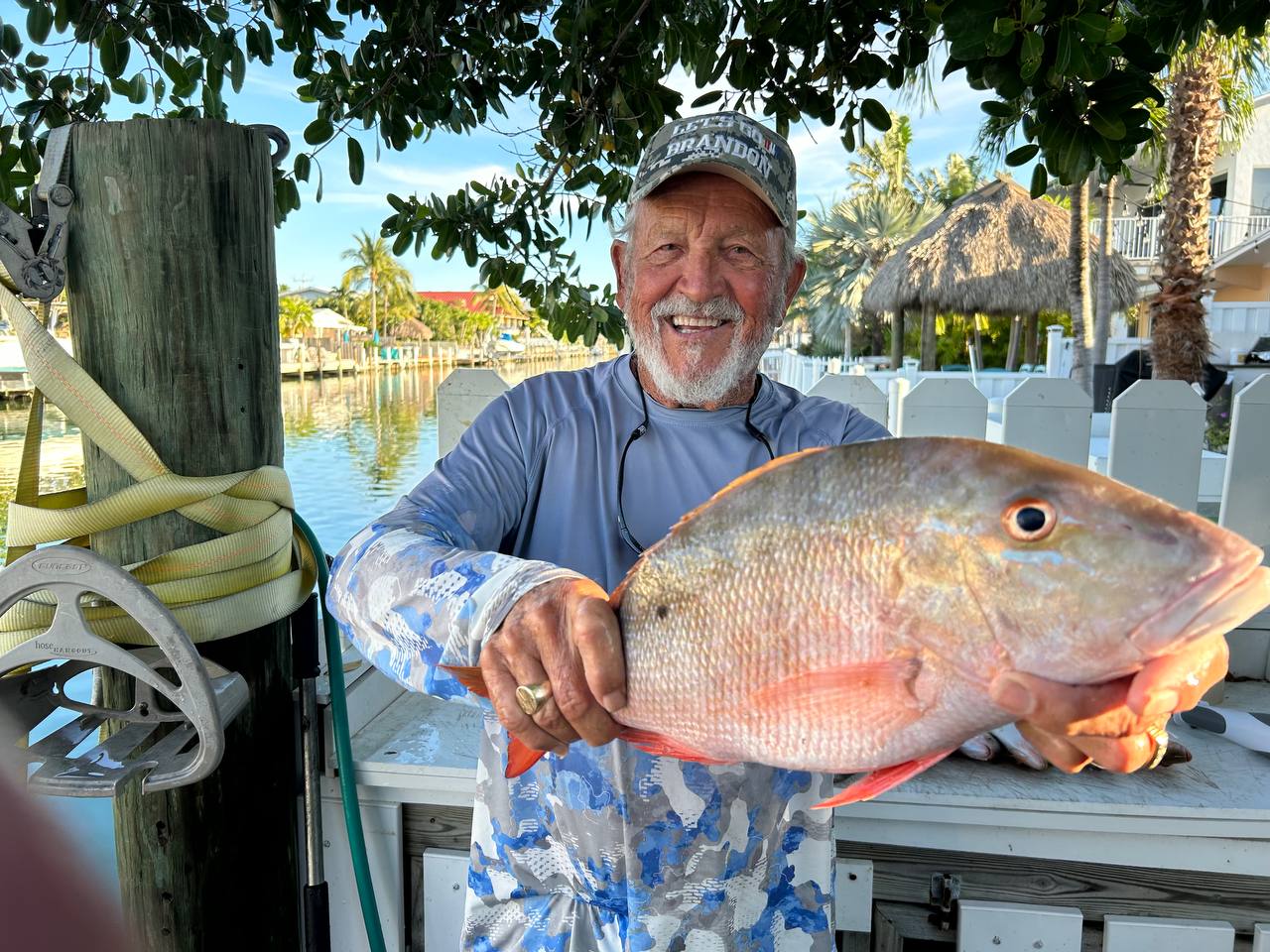 Captain Jim smiling with a big snapper